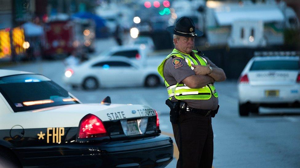 Police and law enforcement officials continued to block off parts of South Orange Avenue near Pulse Nightclub on Monday morning, June 13, 2016 in Orlando, Florida.