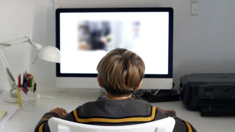 boy-sitting-at-computer.