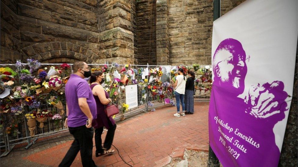 People arrive at St Georges Cathedral to pay respects to late Archbishop Desmond Tutu during his lying in state, in Cape Town, South Africa, December 30, 2021