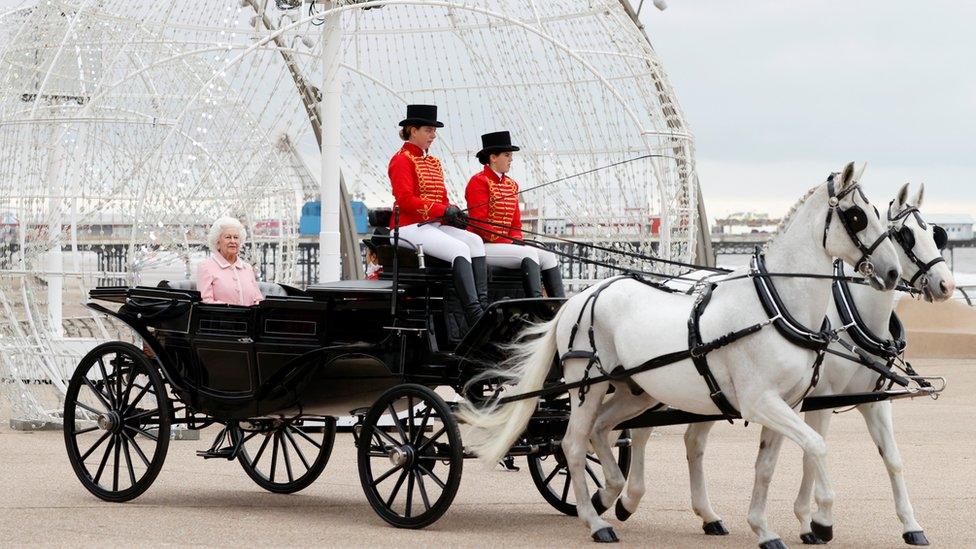 The Queen waxwork arriving in horse and carriage