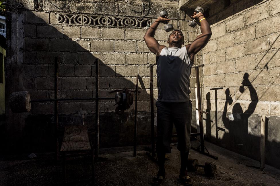 A man works out at one of the makeshift gyms