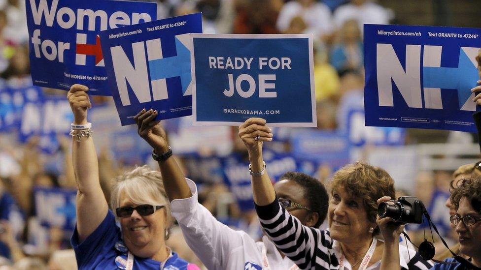 A woman holds up a sign reading "Ready for Joe," referring to U.S. Vice President Joe Biden, while U.S. Democratic presidential candidate Hillary Clinton speaks at the New Hampshire Democratic Party State Convention in Manchester, New Hampshire September 19, 2015