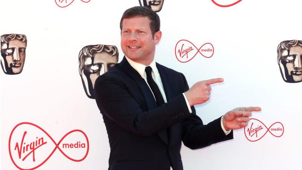 Dermot O'Leary posing on the red carpet at the Baftas