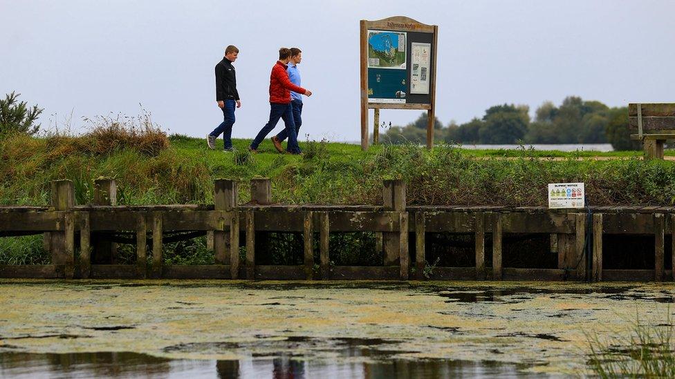 People walking near Lough Neagh