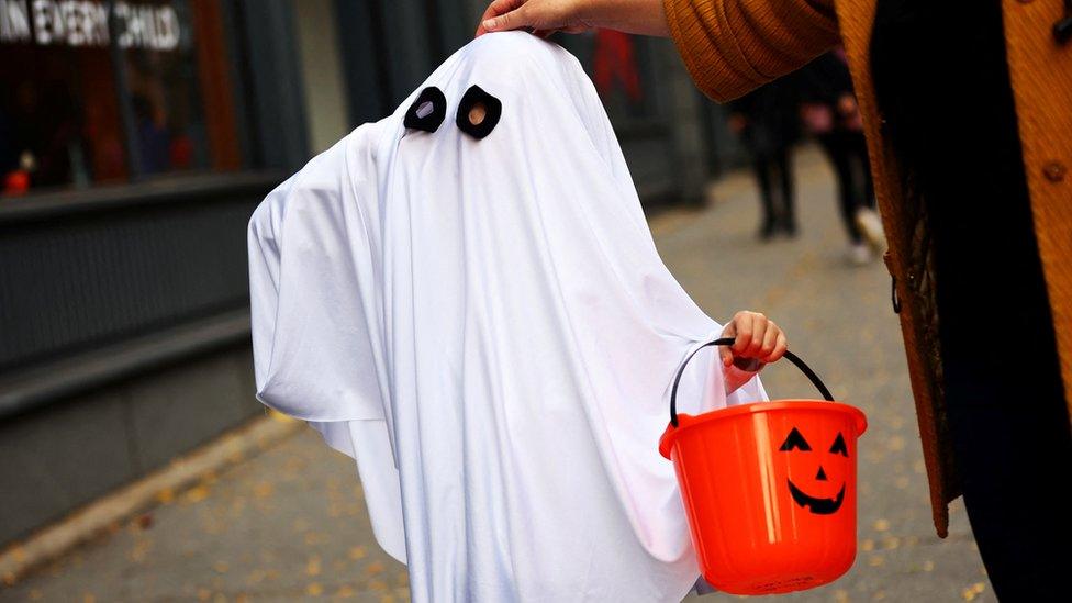 Child in a ghost costume