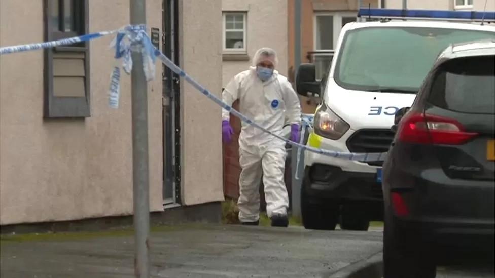 A forensic officer at the scene