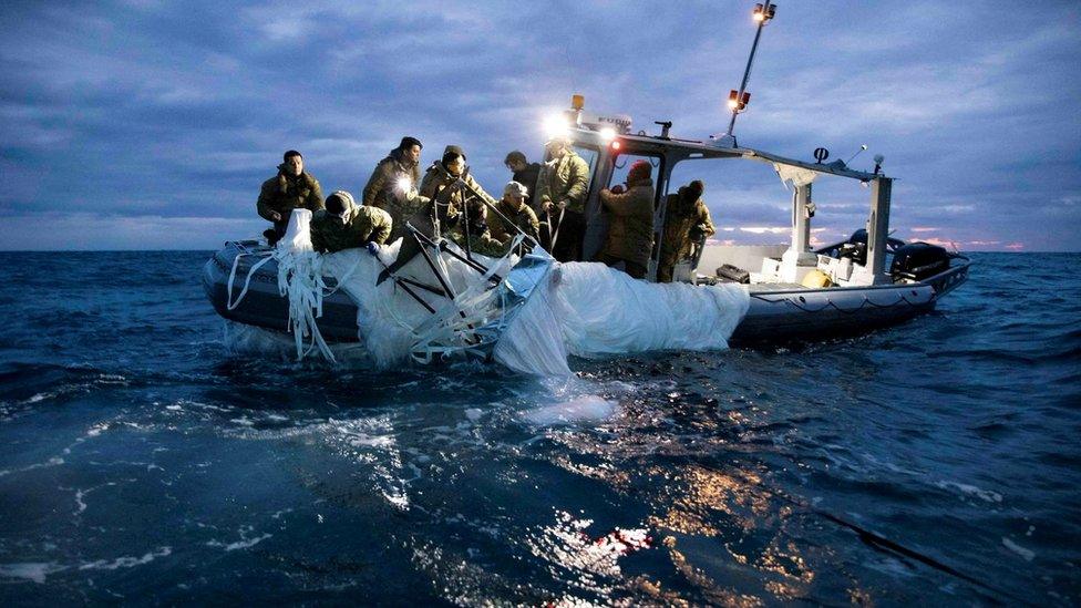 Sailors assigned to Explosive Ordnance Disposal Group 2 recover a suspected Chinese high-altitude surveillance balloon that was downed by the United States