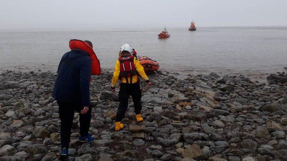 Three Russians being rescued