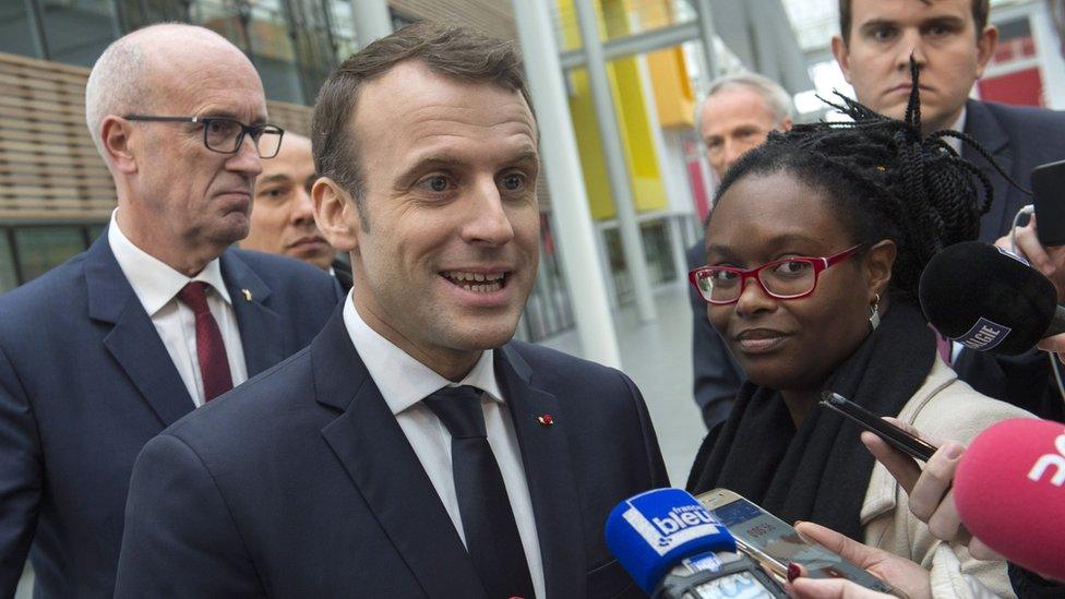 French President Emmanuel Macron gives a press point next to his Public Relations advisor Sibeth Ndiaye (R) during a visit at the Michelin Ladoux Research and Technology centre in Ladoux, central France, on January 25, 2018