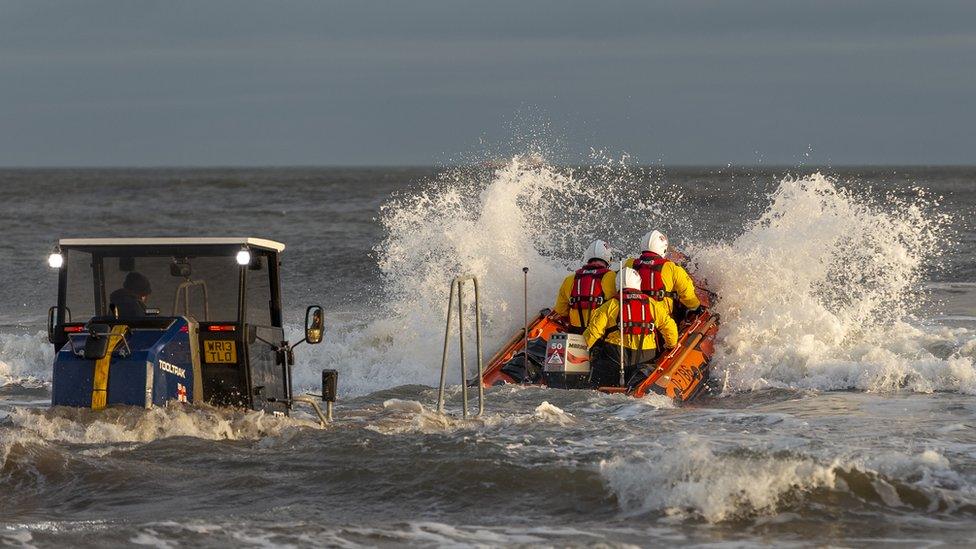 The Redcar RNLI inshore lifeboat was dispatched to rescue the three men and a boy