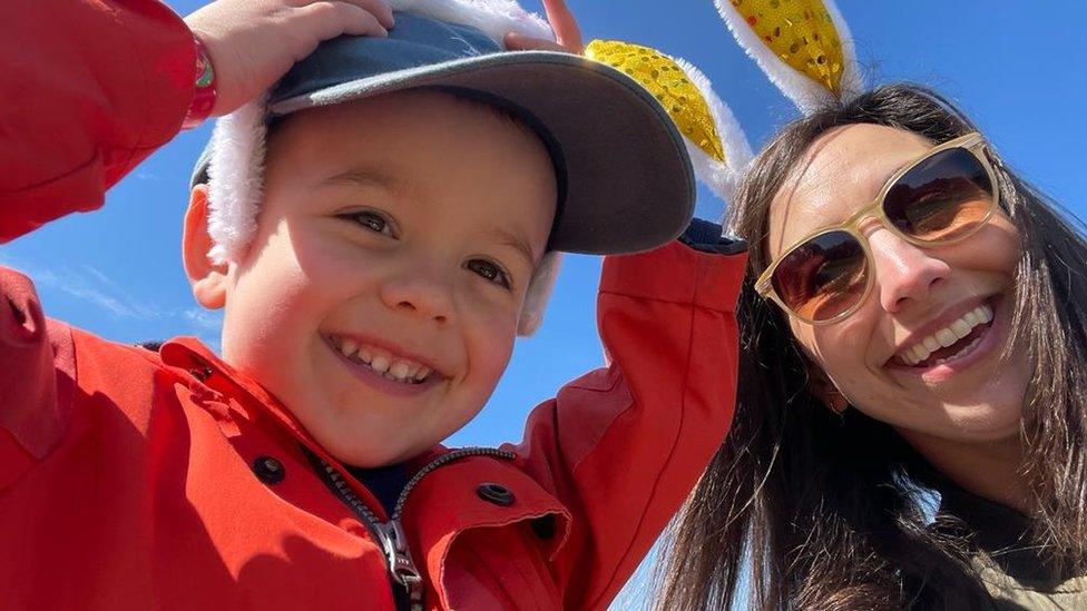 Janine and her son wear Easter bunny ears