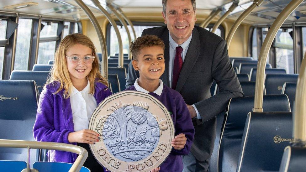 Dan Norris on a bus with children