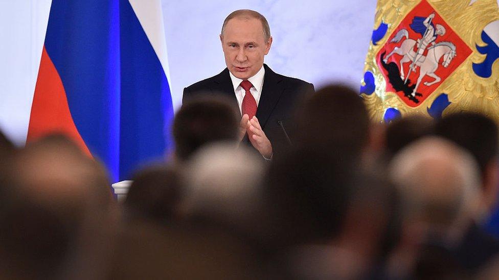 Russian President Vladimir Putin addresses the Federal Assembly of both houses of parliament at the Kremlin