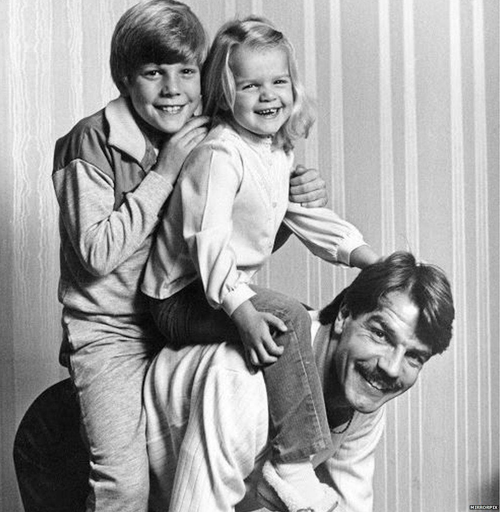 Sam Allardyce with his young kids on his back