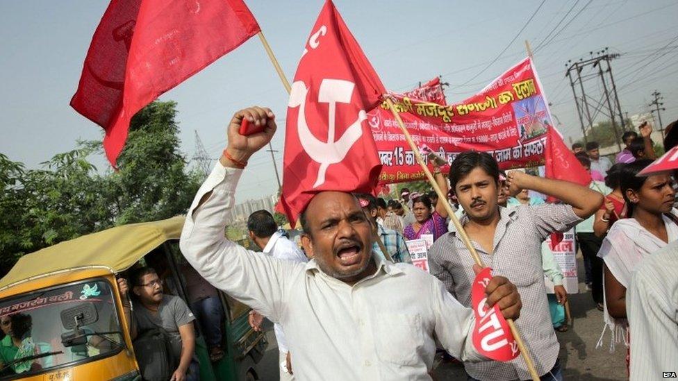 Indian trade union members shout anti government slogans as they participate in a protest near the Noida industrial area in Uttar Pradesh, India during the nationwide strike on 02 September 2015.