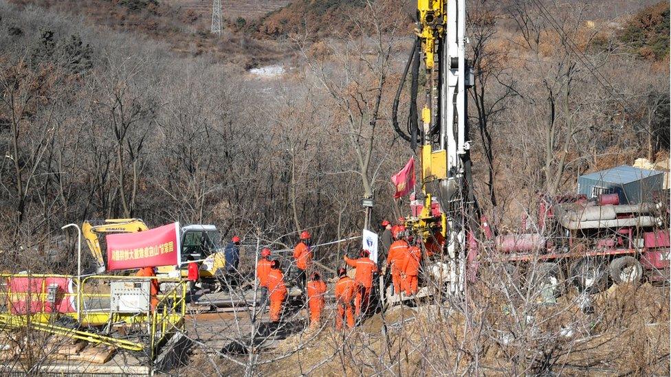 Members of a rescue team work at the site of a gold mine explosion where 22 miners are trapped underground in Qixia, in eastern China's Shandong province on January 18, 2021.