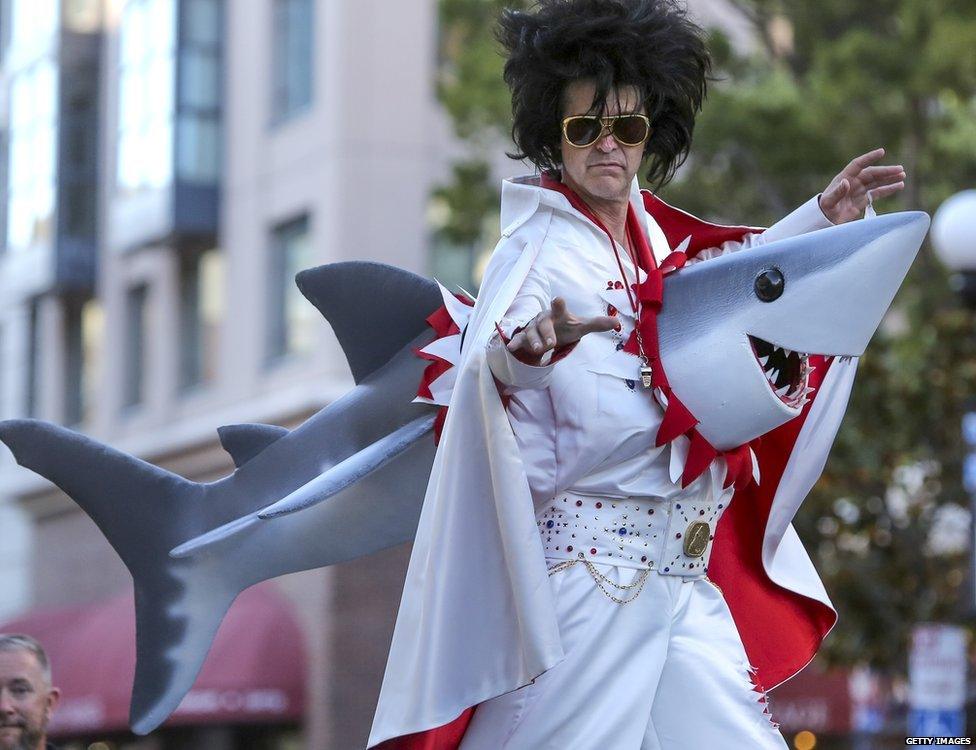 An Elvis impersonator performs on stilt