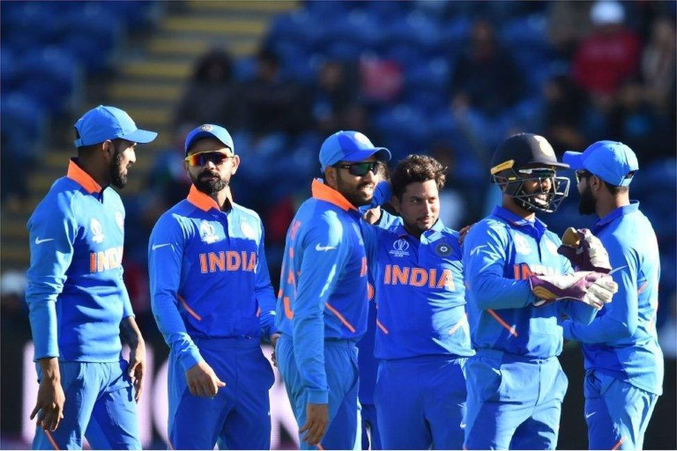 India"s Kuldeep Yadav (C) celebrates with teammates after taking the wicket of Bangladesh"s Mushfiqur Rahim for 90 during the 2019 Cricket World Cup warm up match between Bangladesh v India at Sophia Gardens stadium in Cardiff, south Wales, on May 28, 2019