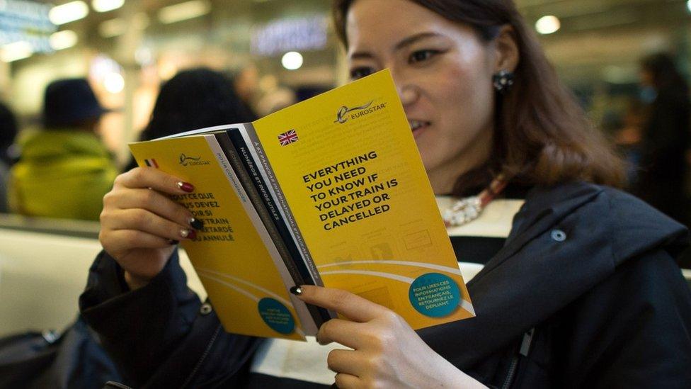 Woman reading Eurostar pamphlet