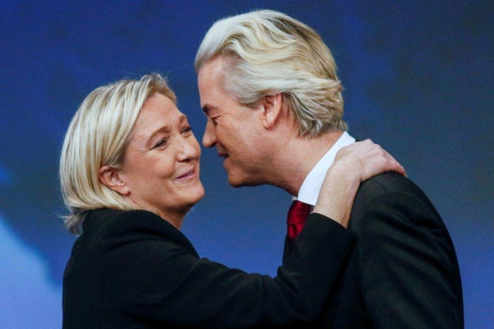 Marine Le Pen, head of France's National Front, kisses Holland's Geert Wilders, president of the PVV (Party for Freedom) in Lyon, France on November 29, 2014.