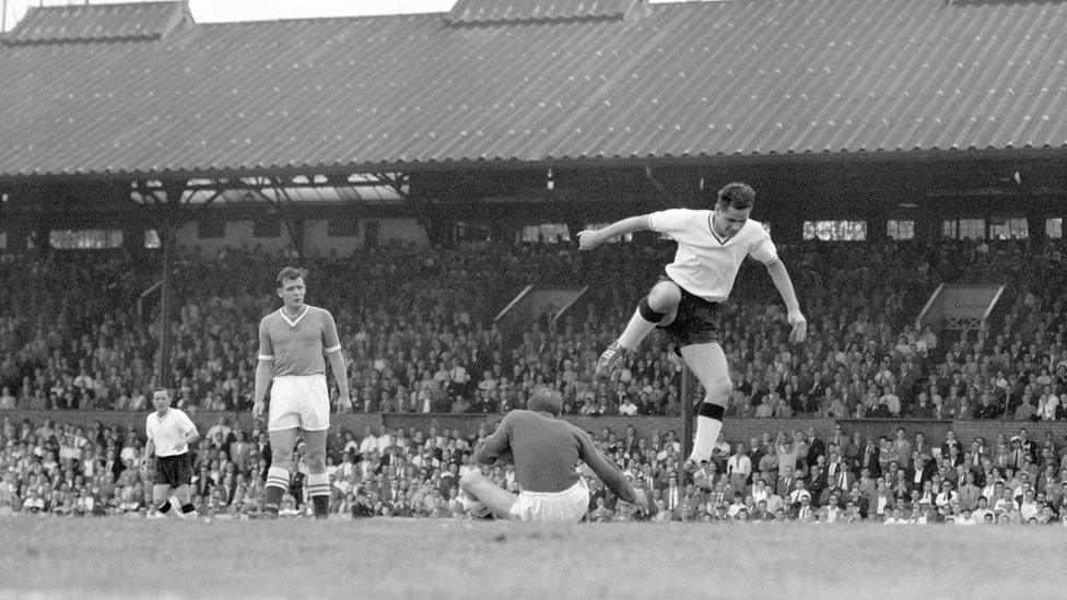 Jimmy Robson clears a goalkeeper