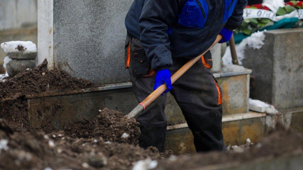 Gravedigger at work