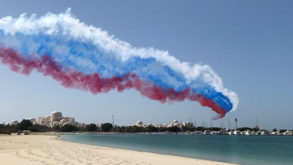 Aircraft blaze a trail in the colours of the Russian flag during Mr Putin's visit to Abu Dhabi on 15 October