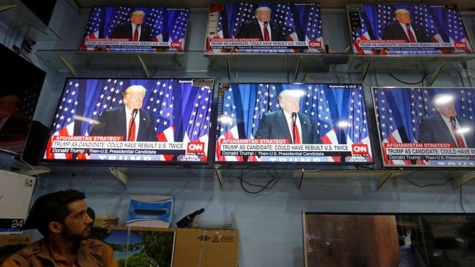 An Afghan man watches the TV broadcast of the U.S. President Donald Trump"s speech, in Kabul, Afghanistan on 22 August 2017.