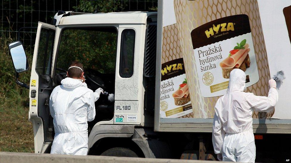 Investigators search a truck on the A4 motorway in Austria that was found with several dead people on board - 27 August 2015