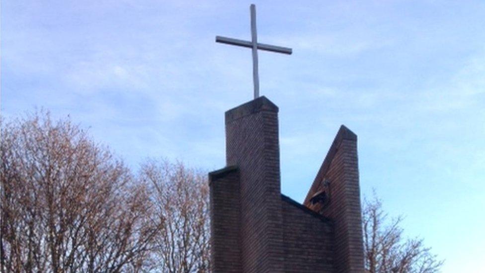 cross monument near Needle Woods