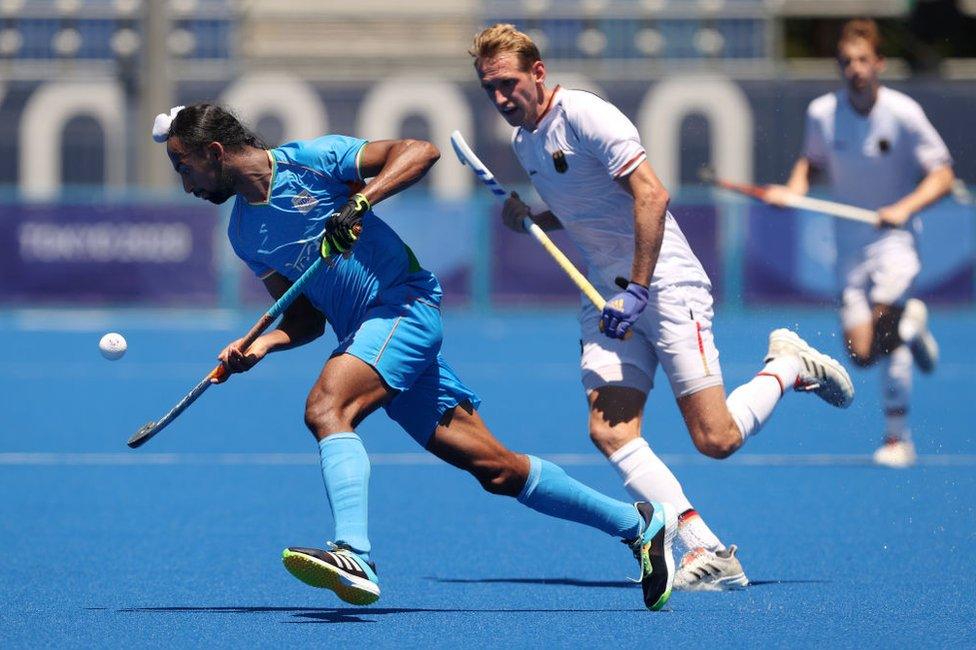 Hardik Singh of Team India moves the ball past Niklas Wellen of Team Germany during the Men's Bronze medal match between Germany and India on day thirteen of the Tokyo 2020 Olympic Games at Oi Hockey Stadium on August 05, 2021 in Tokyo, Japan.