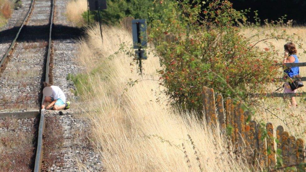 Boy on tracks