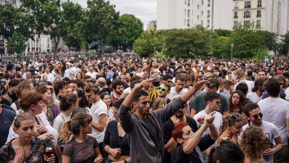 People attending an event for Fete de la Musique in Paris