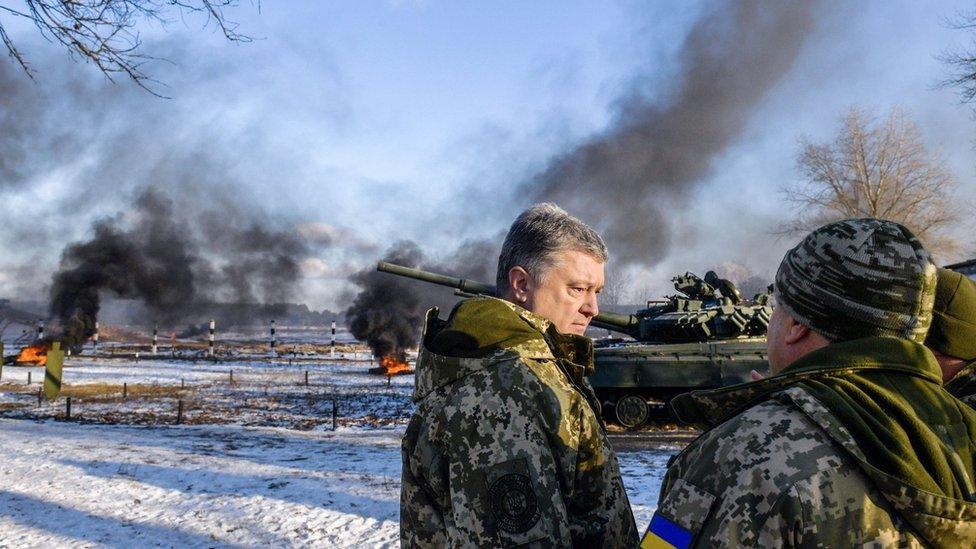 Ukrainian President Petro Poroshenko talks to tank crews during drills in northern Ukraine