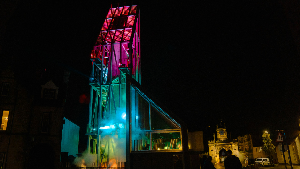 The Auckland Tower in Bishop Auckland illuminated by Phil Supple's artwork The Drop