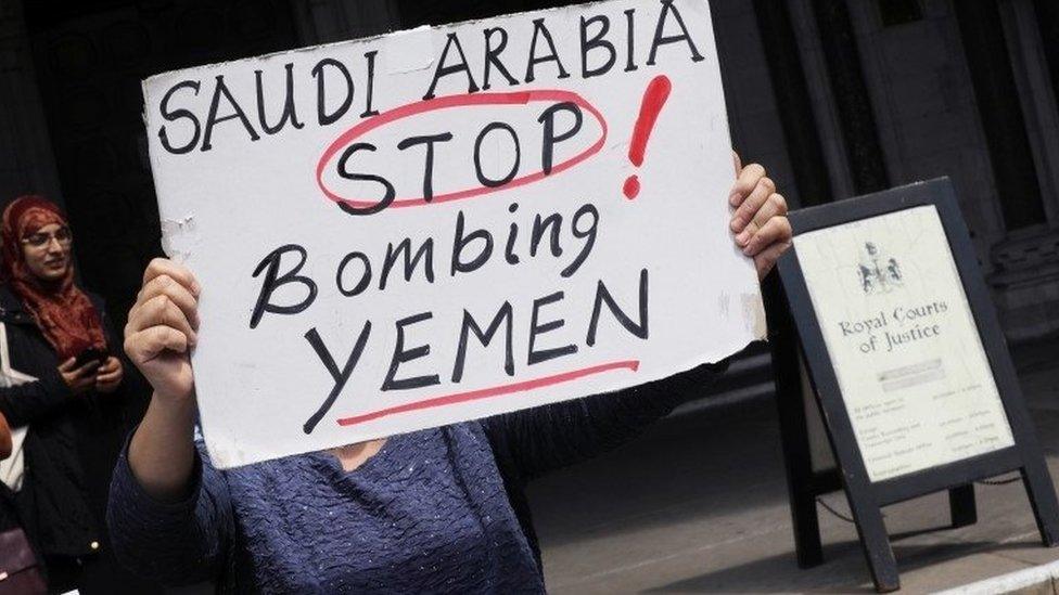 A demonstrator holds a placard outside the Court of Appeal