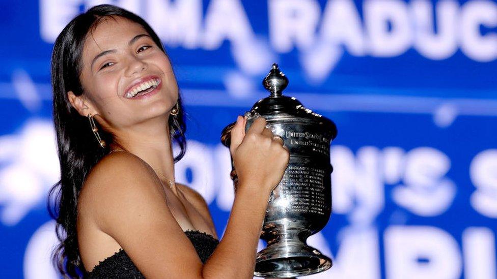 Smiling Emma Raducanu celebrates her victory in the final of the US Open