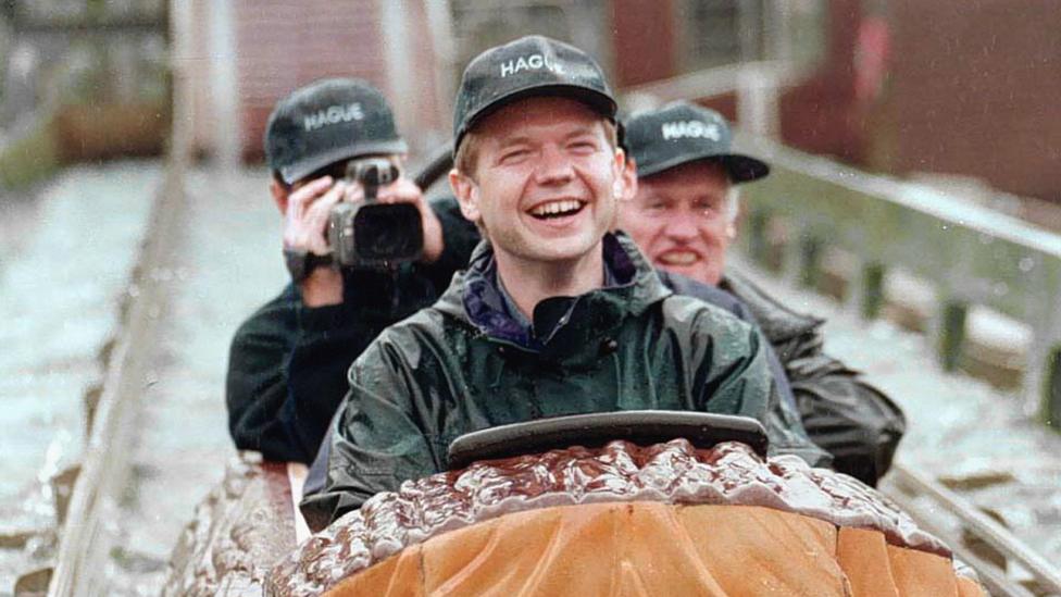 William Hague on a log flume at a theme park