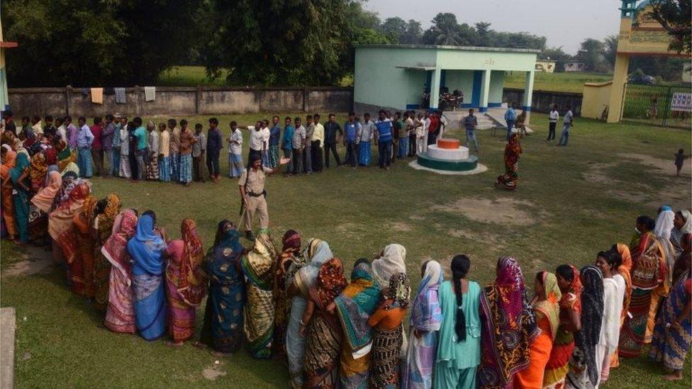 Indian voters queue to cast their ballots at a voting centre in the final stage of state assembly elections in the Bihar village of Thakurganj in Kishanganj district on November 5, 2015.