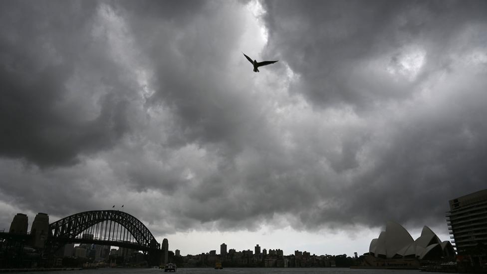 Storm clouds gather over Sydney Harbour on January 20