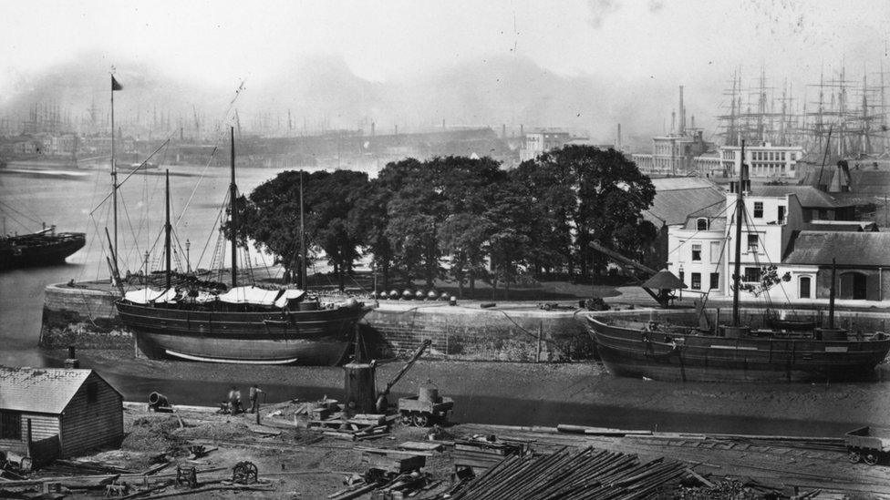 1866: Looking west from Trinity Wharf; the terminal of the Blackwall Railway is in the distance on the right. The masts in the distance on the left are in the West India docks on the Isle of Dogs