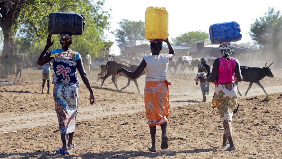 Women carry water in drought-stricken Mozambique