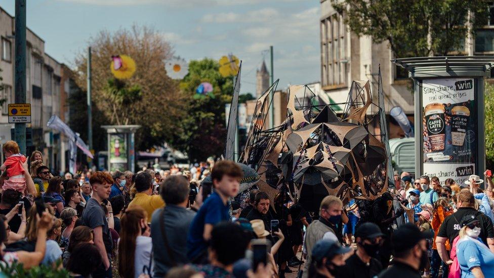 Dragon walks through crowds