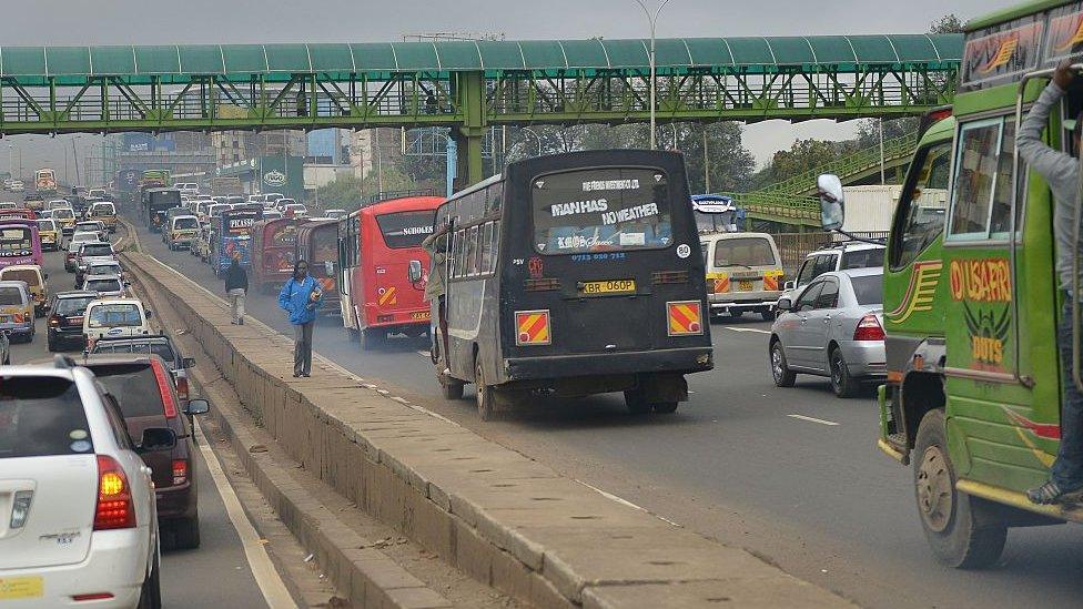 Cars are stuck in traffic on a motorway on October 22, 2014 in the Kenyan capital Nairobi during a typical morning commute.