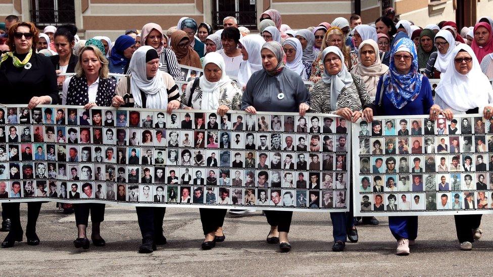 Women from Srebrenica hold a banner showing pictures of the 1995 Srebrenica massacre, during a peaceful demonstration at Alija Izetbegovic Square in Zenica, Bosnia and Herzegovina, 11 June 2023. More than 8,000 Muslim men and boys were executed in July 1995 after Bosnian Serb forces overran the town of Srebrenica during the Bosnian War.