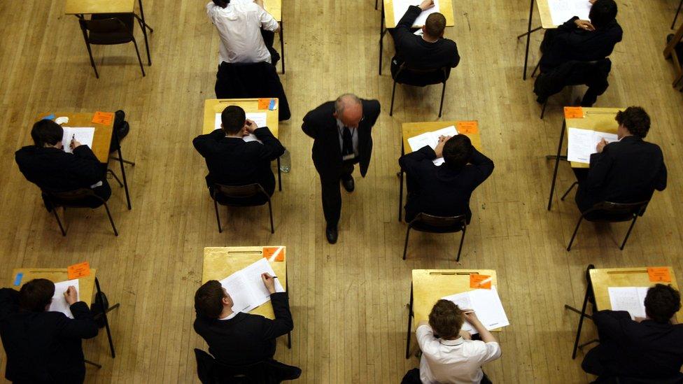 view from above of students taking an exam