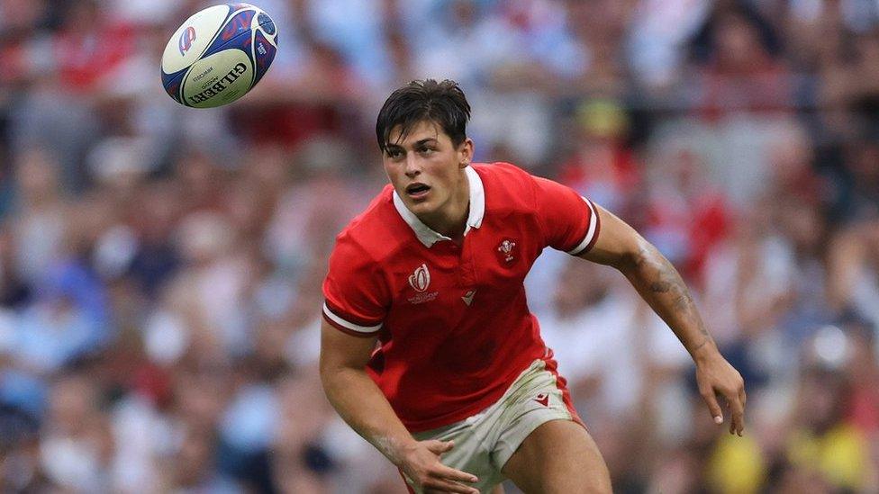 Louis Rees-Zammit chases the ball for Wales