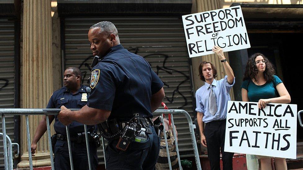 New York City police put up barricades after protests for and against the building of a new mosque just a few blocks away from where the twin towers once stood.