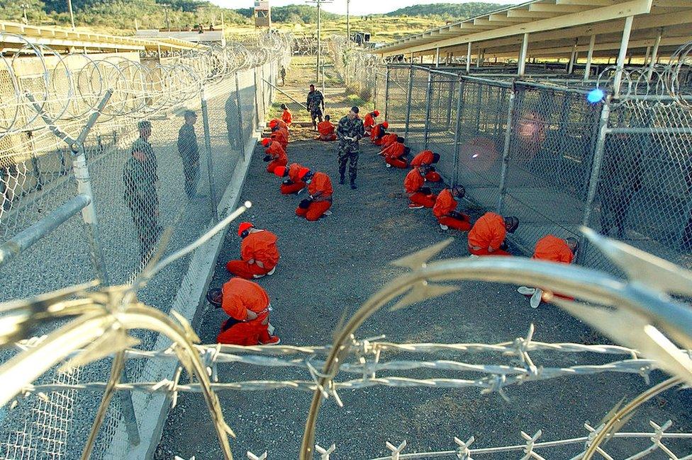 Detainees in orange jumpsuits at the detention camp at Guantanamo Bay, in January 2002.