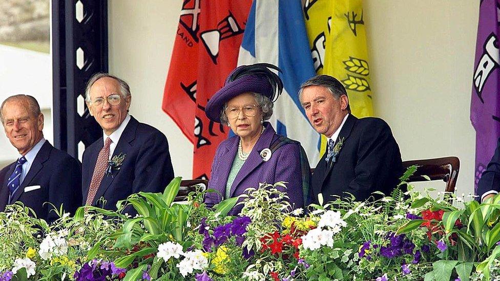 Queen Elizabeth sits with Presiding officer Sir David Steel (right), First Minister Donald Dewar (second left) and Prince Philip (far left), at the close of the ceremony for the new Scottish Parliament in Edinburgh in 1999